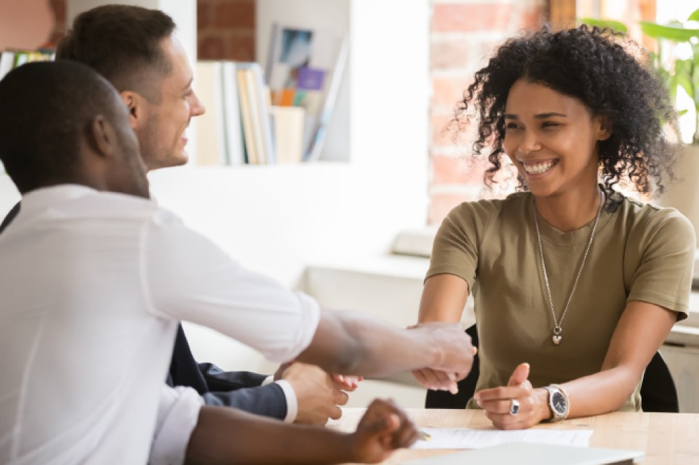 Woman shaking hands with others