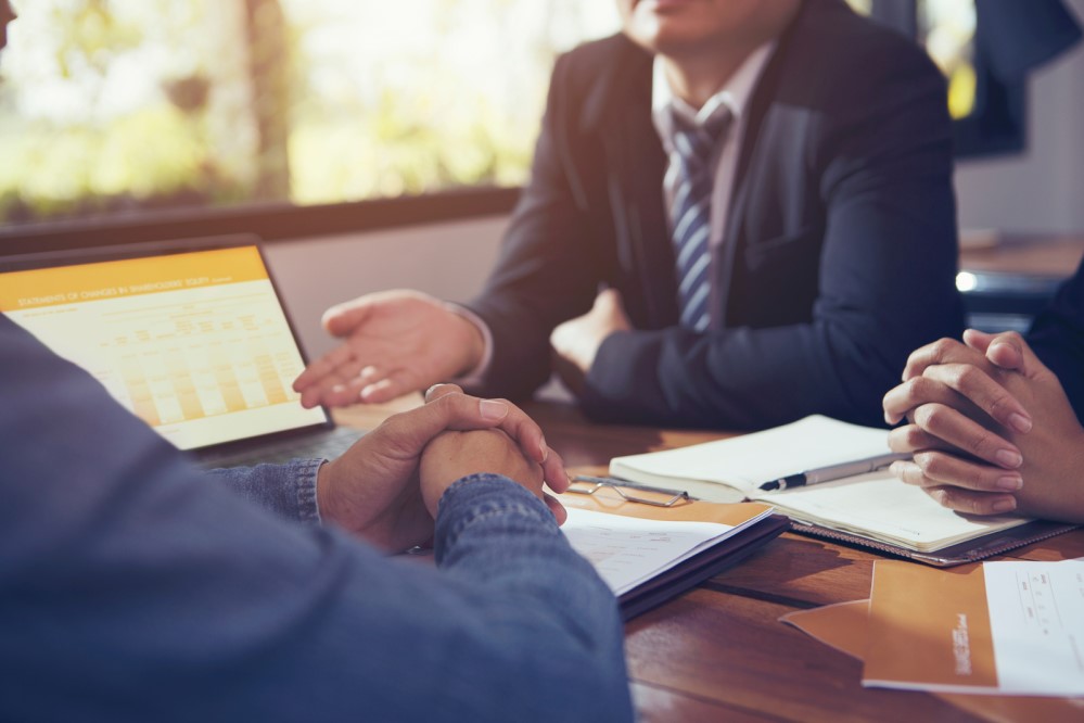 Image of business folk at a table