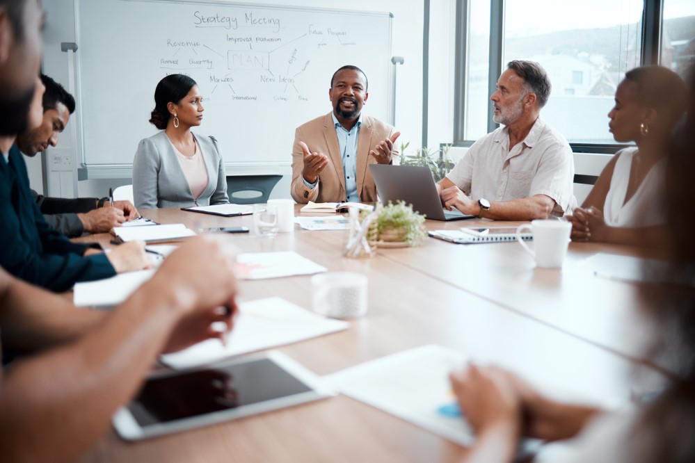 Image of folks at a conference table