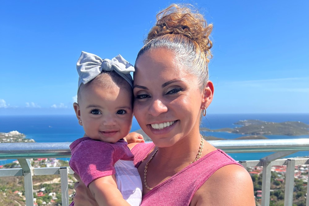 Teresa De Castro holding her daughter