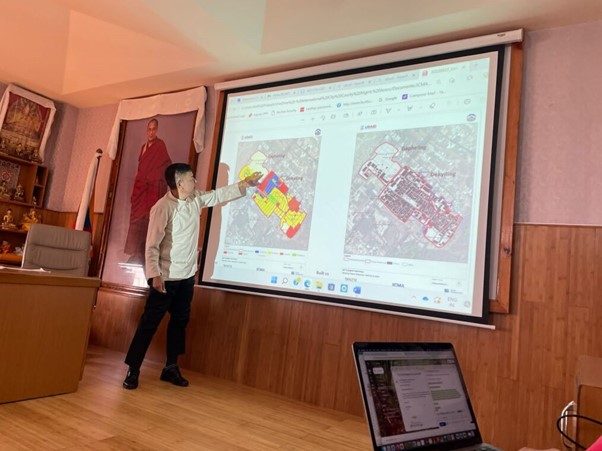 The Sikyong (Political Leader of the CTA) is reviewing a Global Information Systems (GIS) map of Dekyiling and Gapheling settlements in the state of Uttarakhand, prepared by the ICMA and UMC team. 