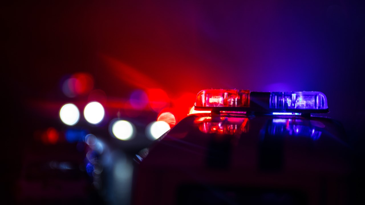 Image of blue and red lights from police cars