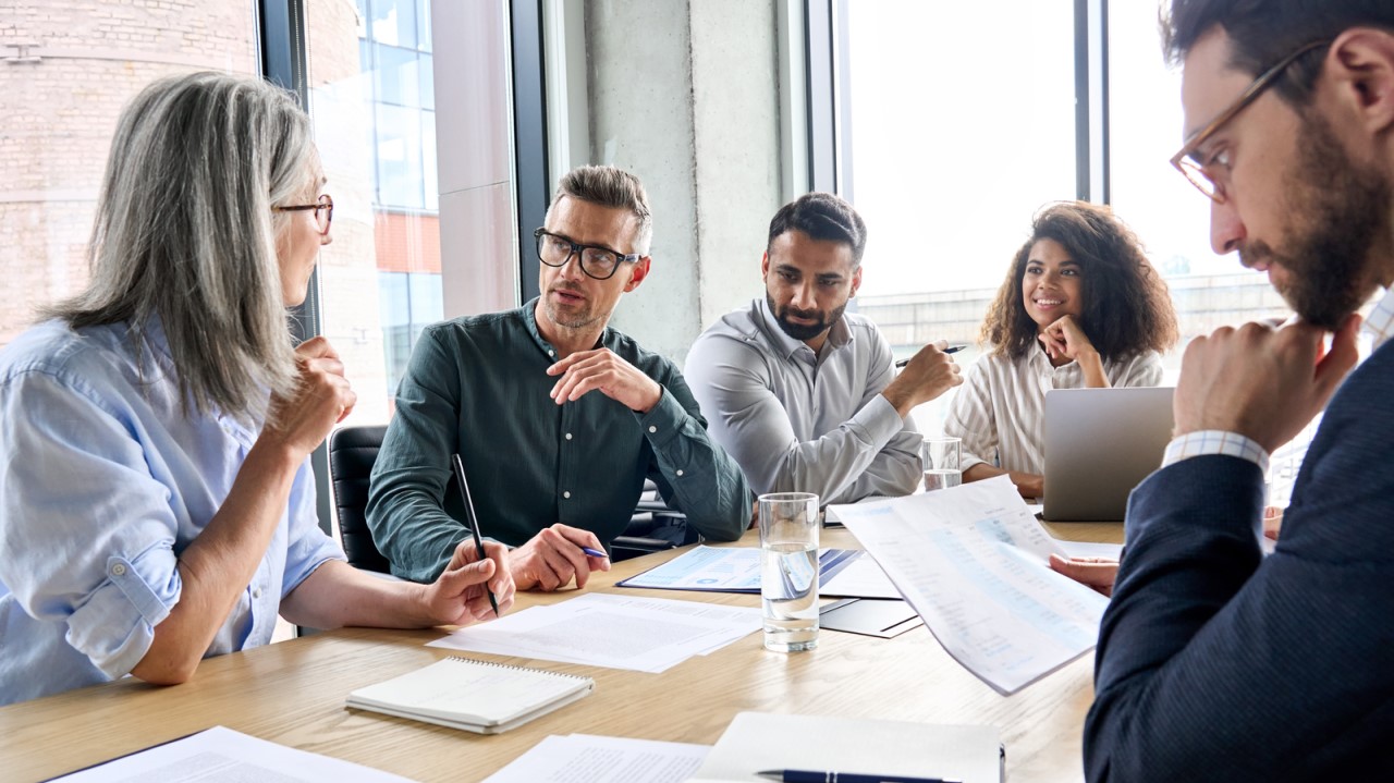 Image of people at a conference room table