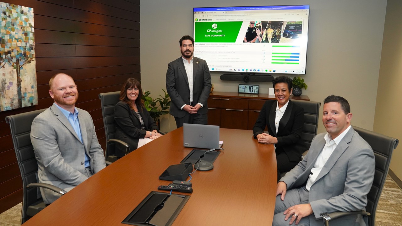 Chance Wood (middle) presenting the dashboard to the Cedar Park City Manager’s Office. Left to right: Chris Copple, assistant city manager; Brenda Eivens, city manager; Yoko Matsumoto, assistant city manager; and Beau Falgout, assistant city manager.