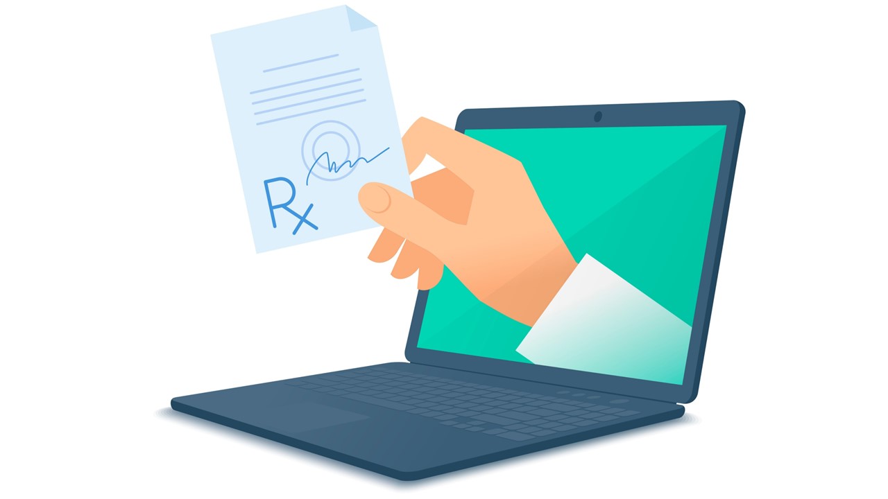 Image of laptop with doctor's hand holding prescription