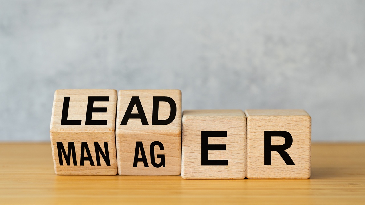 Image of blocks that say LEADER and MANAGER