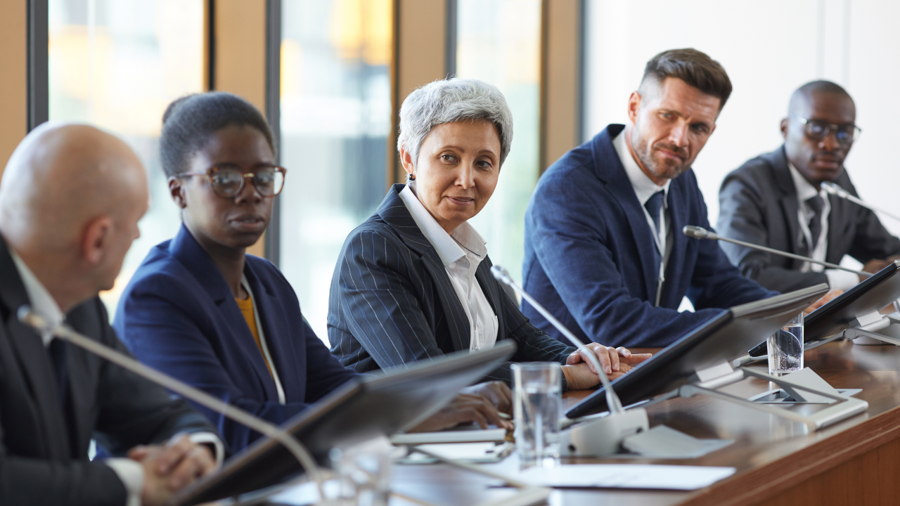 Business meeting with people around a conference table. 