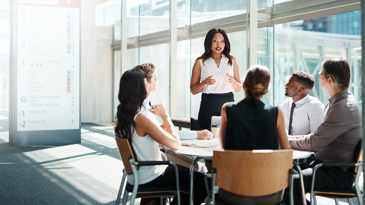 Image of leader talking to employees