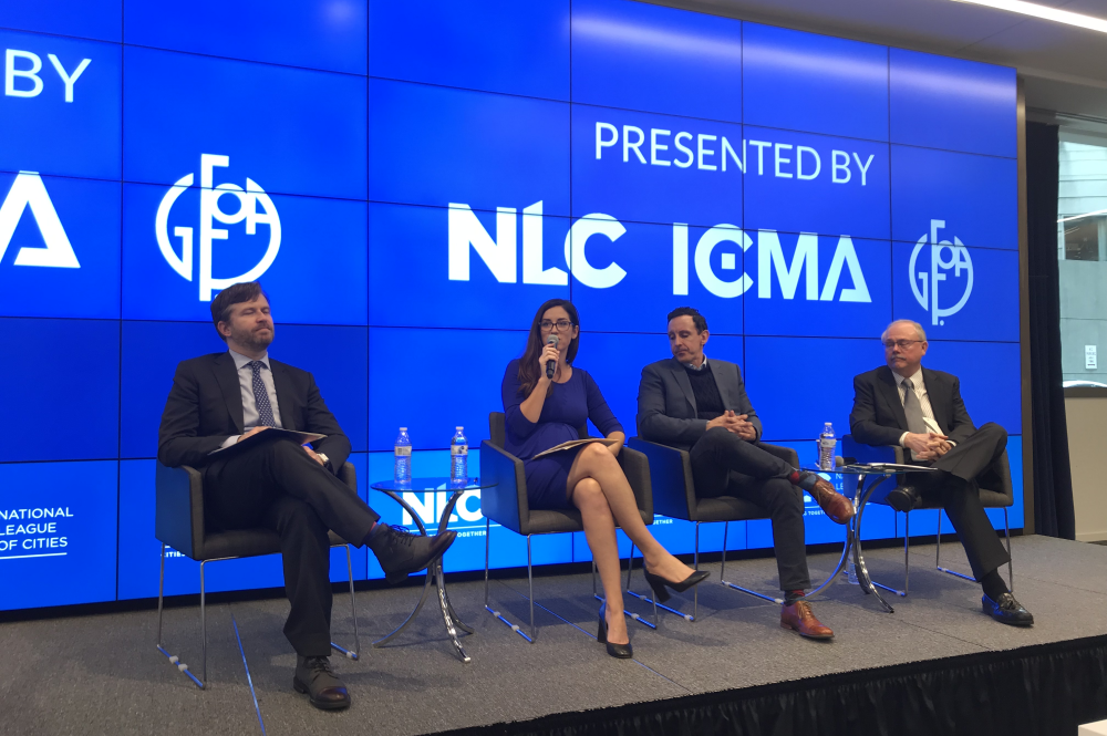 Panelists at event sitting on stage