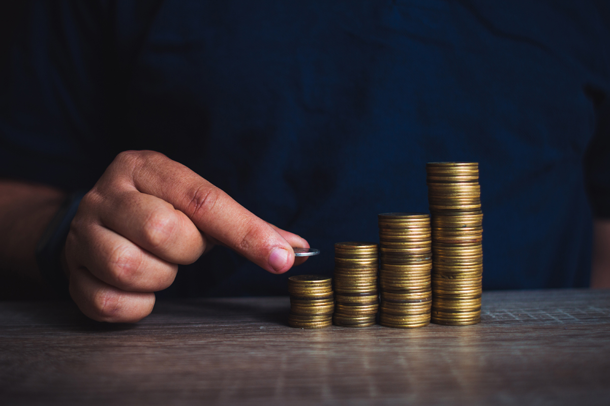 Man stacking coins