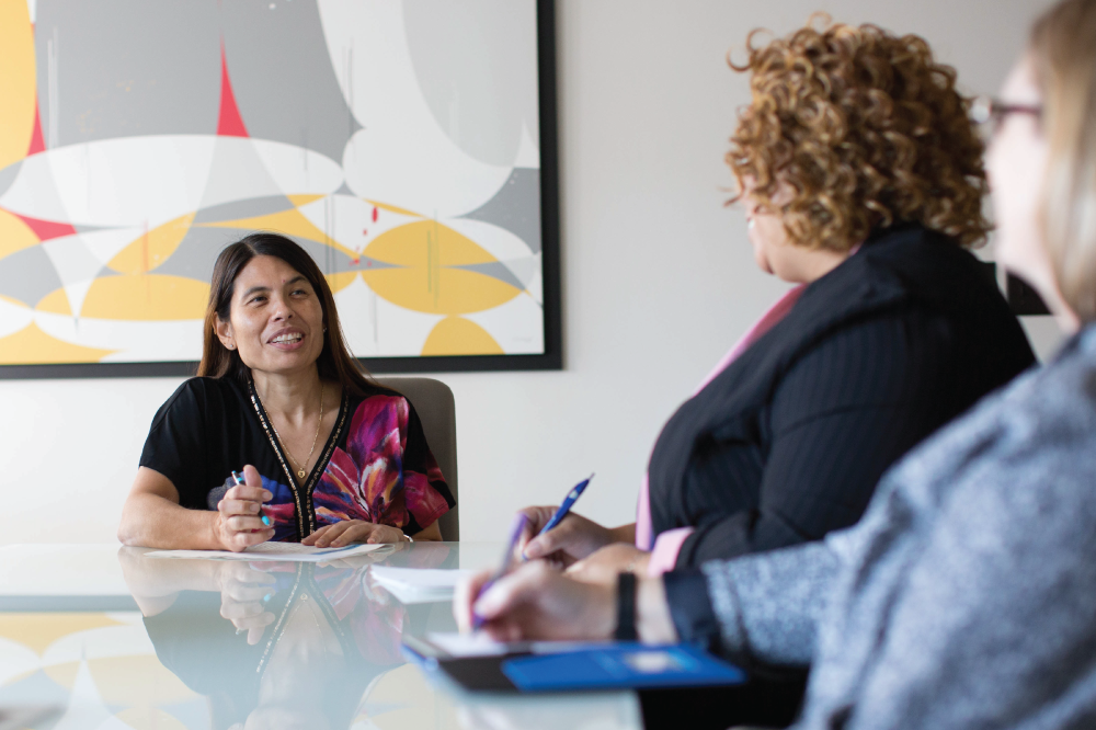 women around meeting table