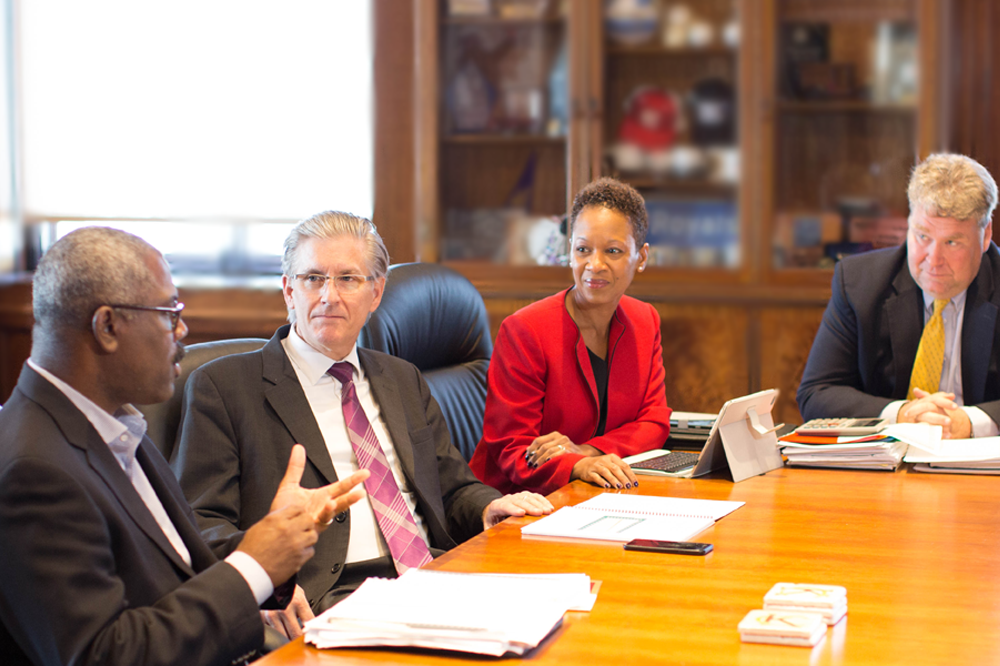 men and woman in meeting room