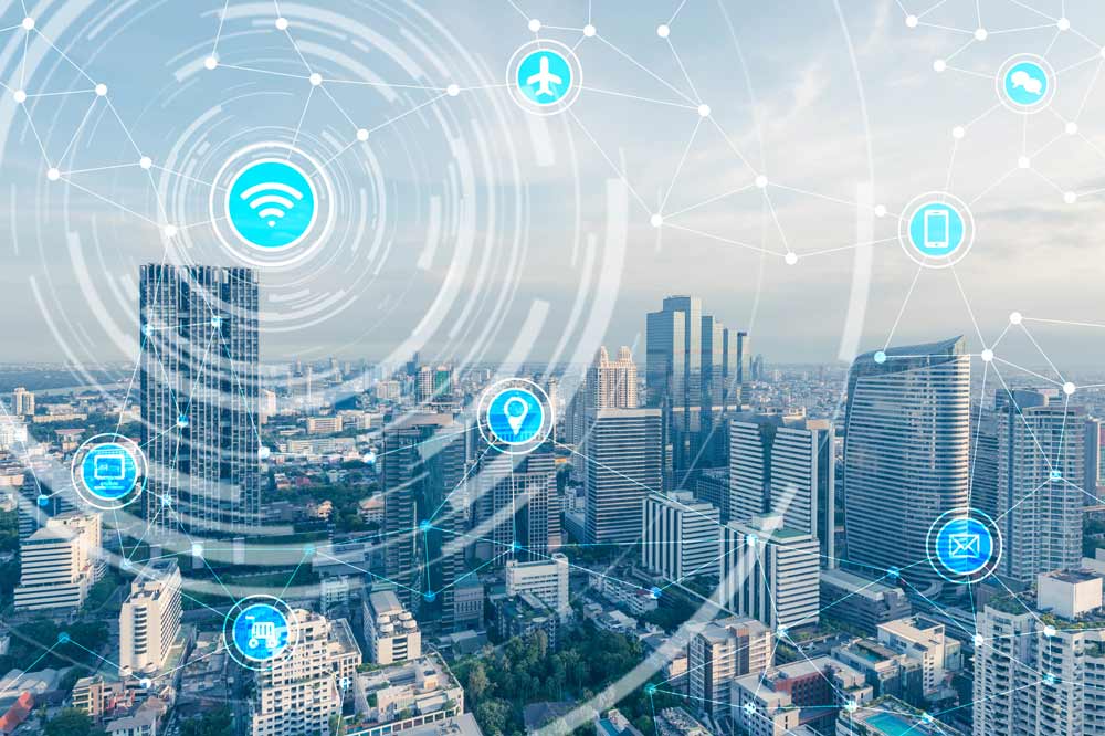 cityscape with light beams connecting different technology icons hovering above buildings representing a city connected through technology