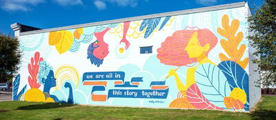 Silverton Mural of 3 women with quote saying "We are all in this story together" by Sally Atkins