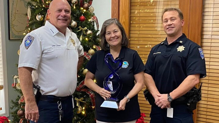 Photo of three Indian Creek employees accepting the award on the recipient's behalf