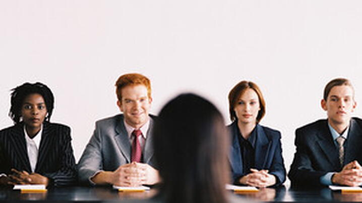 person sitting in interview