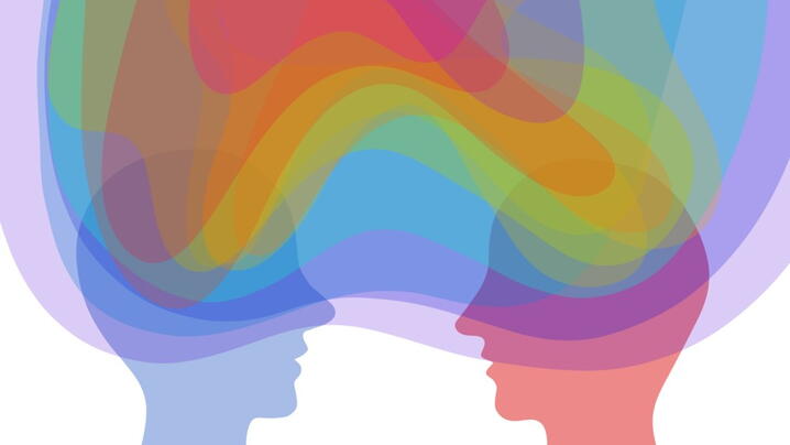 Illustration of two silhouettes with a rainbow cloud around them