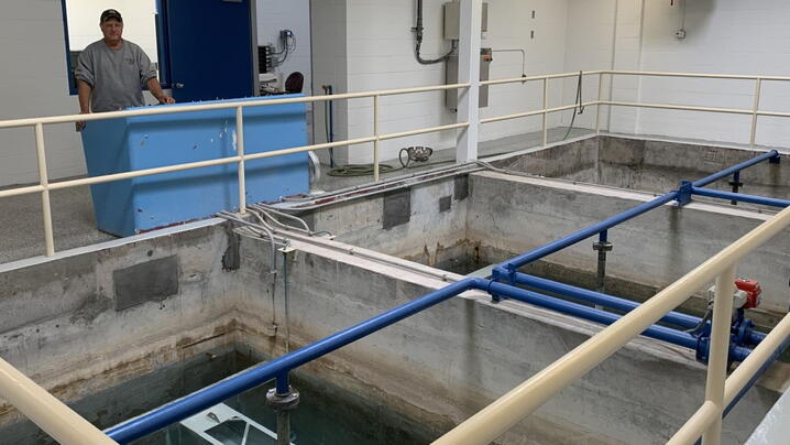 Water treatment plant employee oversees operations