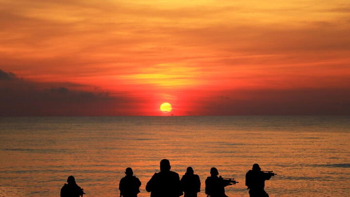 Navy seals in front of sunset