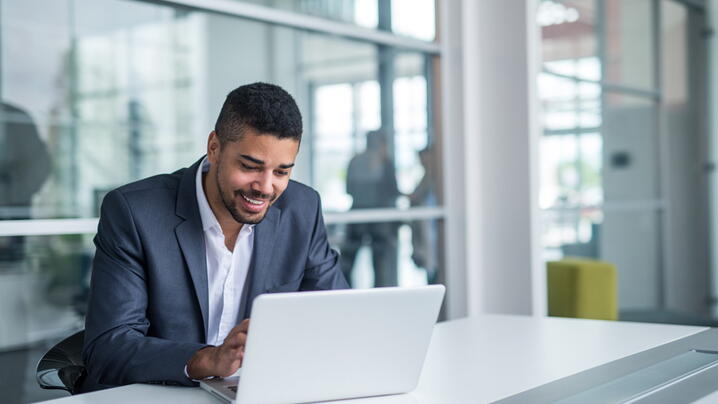 Black man working on a computer