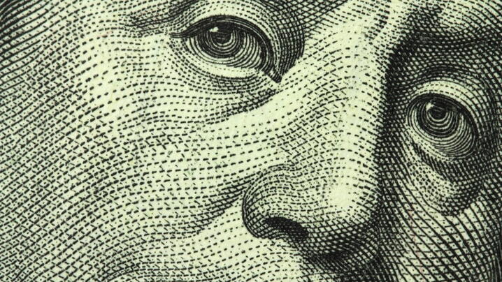 Close-up image of Benjamin Franklin from $100 bill