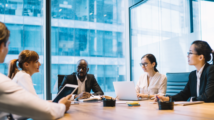 Multiethnic coworkers at table on business meeting