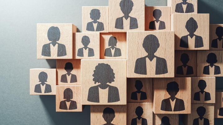 Image of blocks with silhouetted heads on them