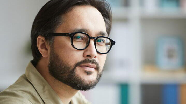 Man with glasses gazing
