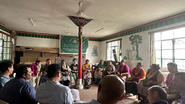 The ICMA and NDI field office team facilitating focus group discussion with shareholders of a Tibetan cooperative society in the state of Himachal Pradesh.