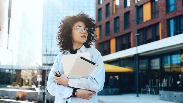 Image of woman holding files