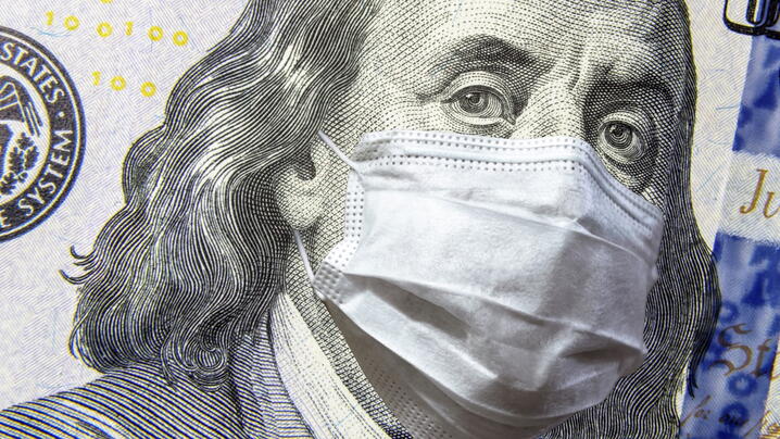 Image of Ben Franklin on $100 bill in a mask