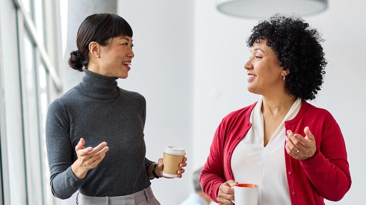 Image of two people talking 