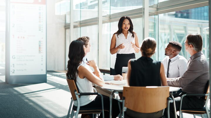 Image of leader talking to employees