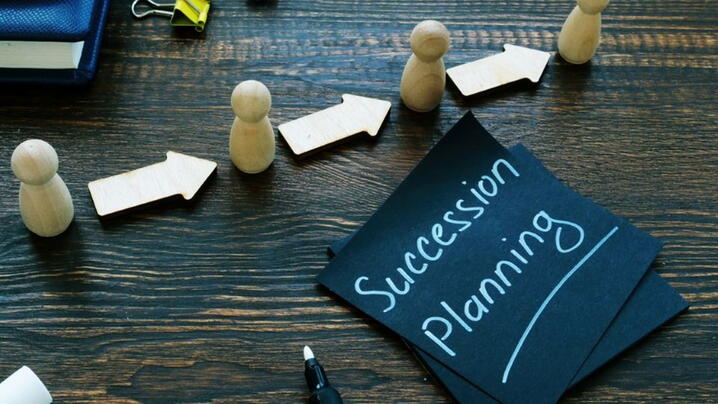 Image of note that says 'succession planning'