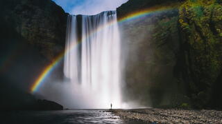 Rainbow in front of waterfall