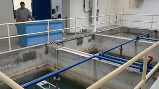 Water treatment plant employee oversees operations