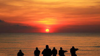 Navy seals in front of sunset