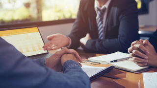 Image of business folk at a table