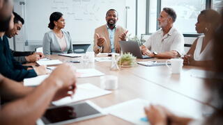 Image of staff at a conference table