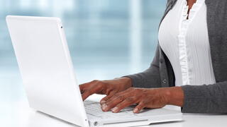 Image of person on a laptop