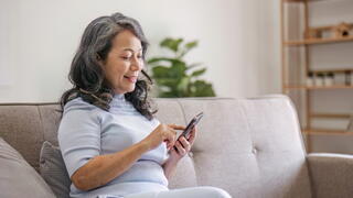 Image of woman using her phone