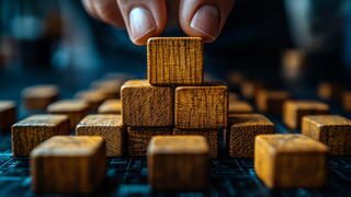 Wood blocks stacked in a pyramid shape.