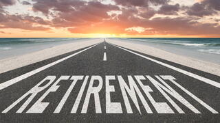 Image of road with "retirement" painted on it