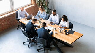 Image of team at conference room table