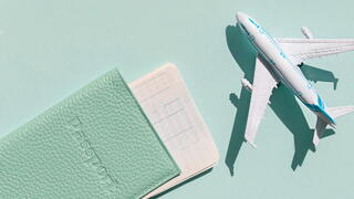 Image of passport and plane