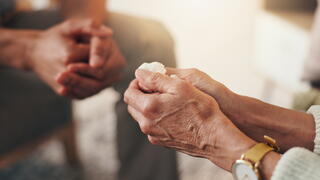 Image of hands holding a tissue