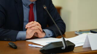 Image of person at microphone
