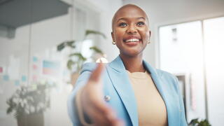 Image of person with arm extended to shake hands