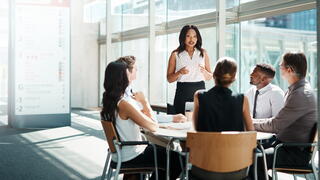 Image of leader talking to employees