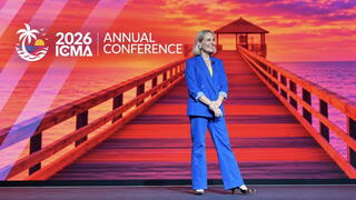 Speaker Liz Bohannon smiles onstage at ICMA’s 2026 Annual Conference 